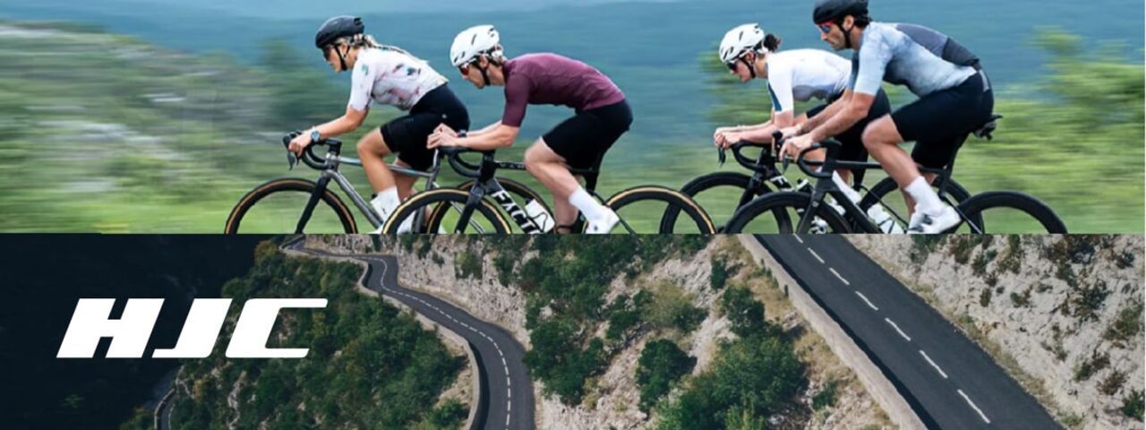 Vier Rennradfahrer mit HJC-Helmen auf einer kurvigen Bergstraße – aerodynamisch, leistungsstark und sicher unterwegs.